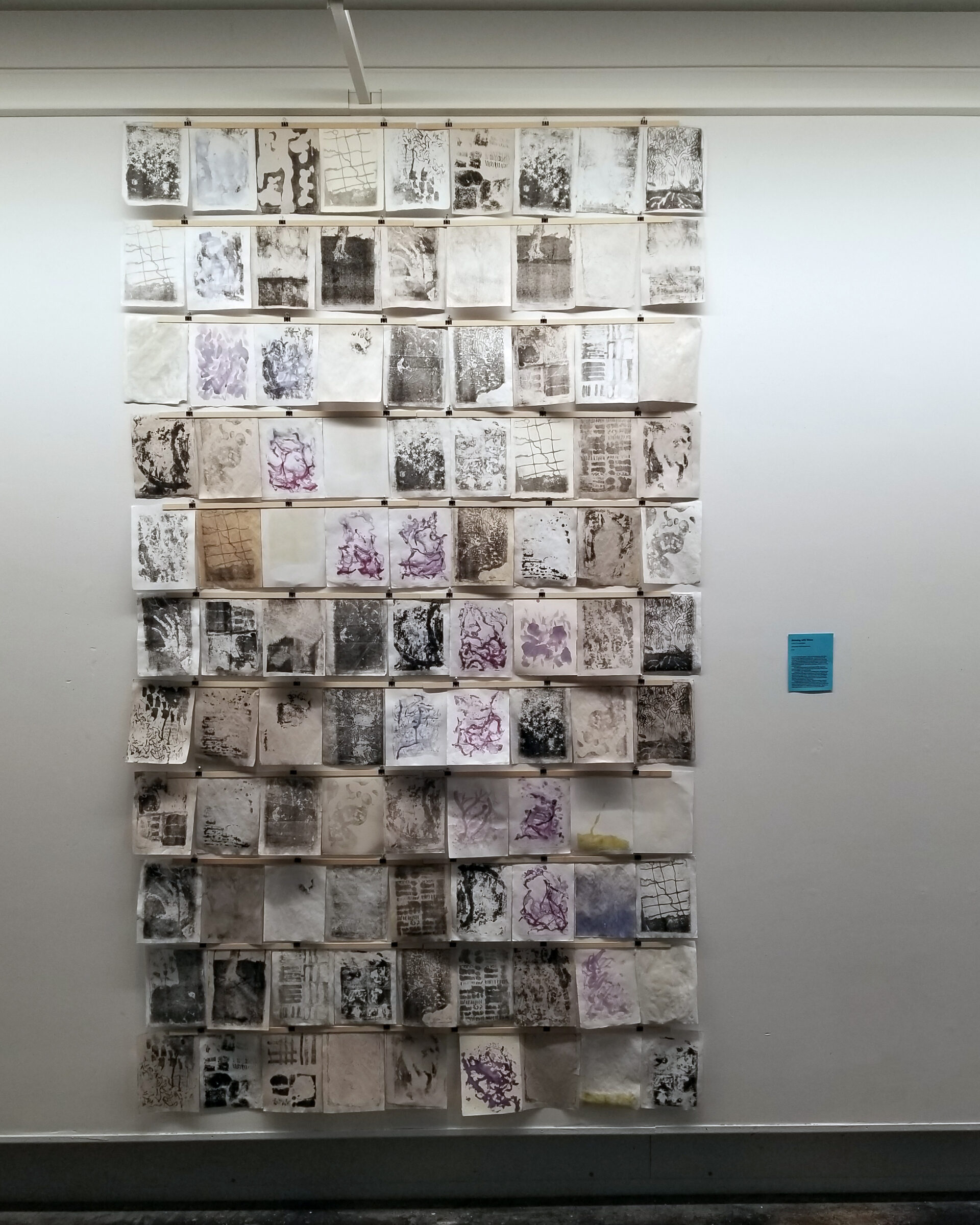 99 abstract prints in black, white and purple.