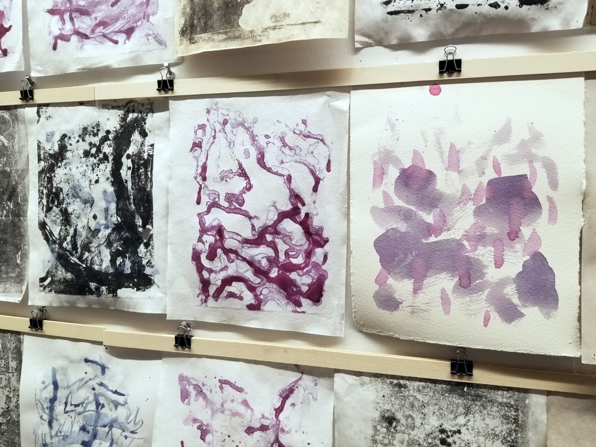 Abstract prints in black, white and purple.