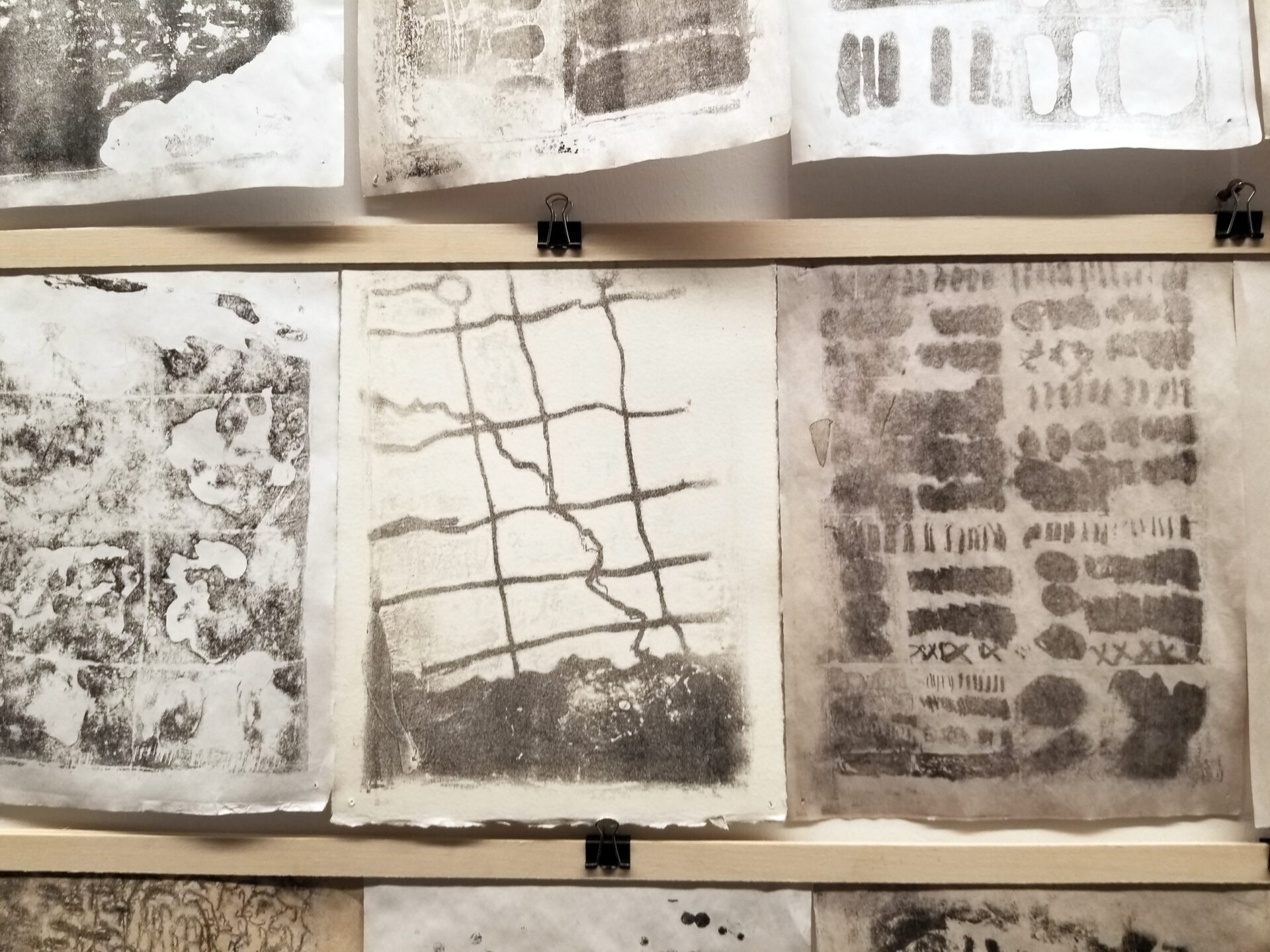 Abstract prints in black, white and purple.