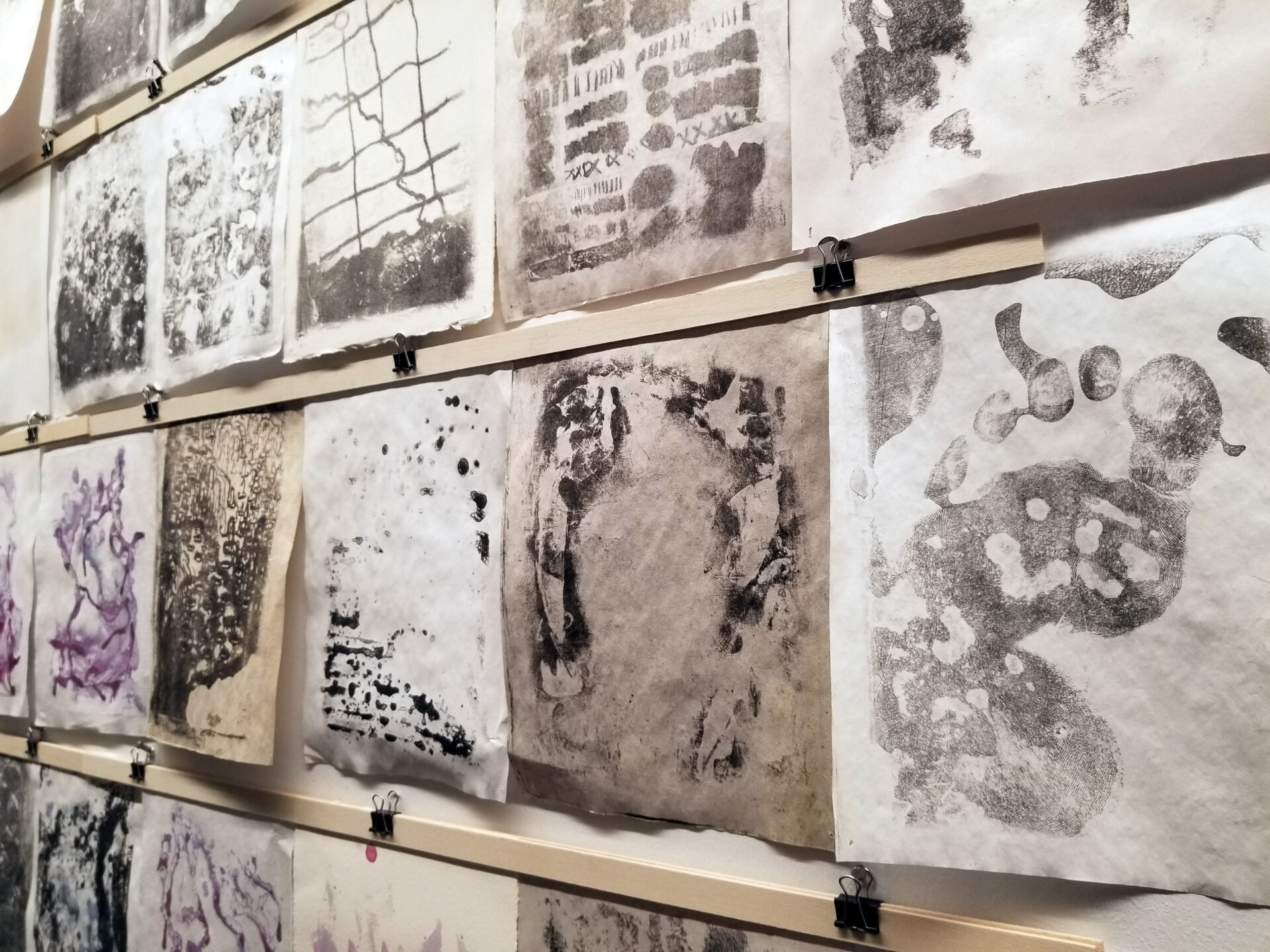 Abstract prints in black, white and purple.